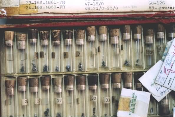 box with assortment of balance staffs for watches