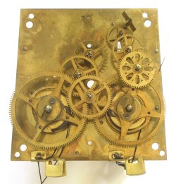 Gustav Becker clock plate removed and gears visible